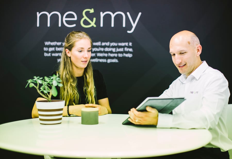 Anthony Hartcher reviewing a wellness plan with a client Anthony Hartcher reviewing a wellness plan with a client
