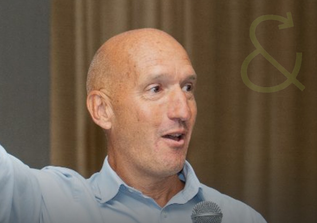 Anthony Hartcher speaking on stage