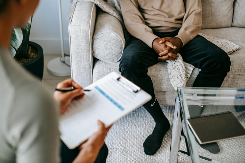 Client in a one-on-one wellness consultation Client in a one-on-one wellness consultation
