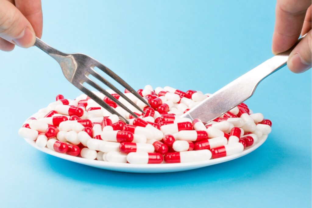spoon and fork used to eat weight loss drugs pills 