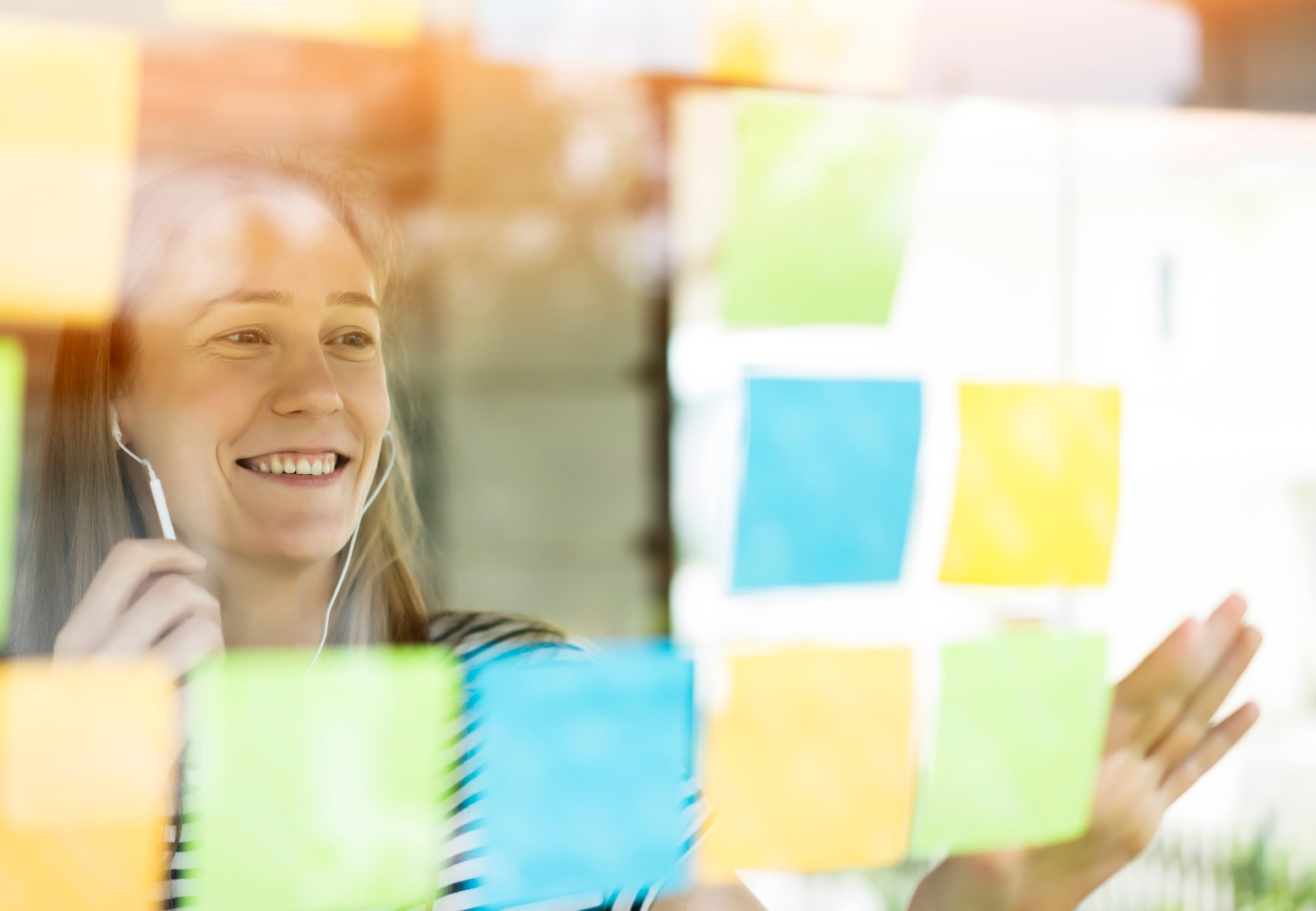 Woman sticking post it notes